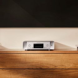 Marantz CD 50n Silver Gold on a media console below a TV
