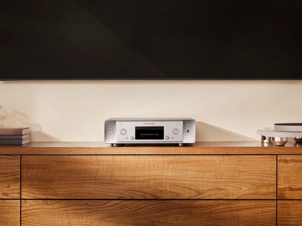 Marantz CD 50n Silver Gold on a media console below a TV